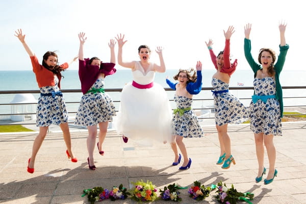 Bride and bridesmaids jumping