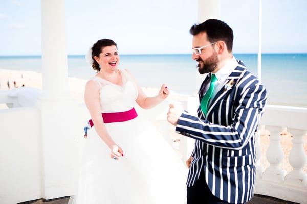 Bride and groom laughing together