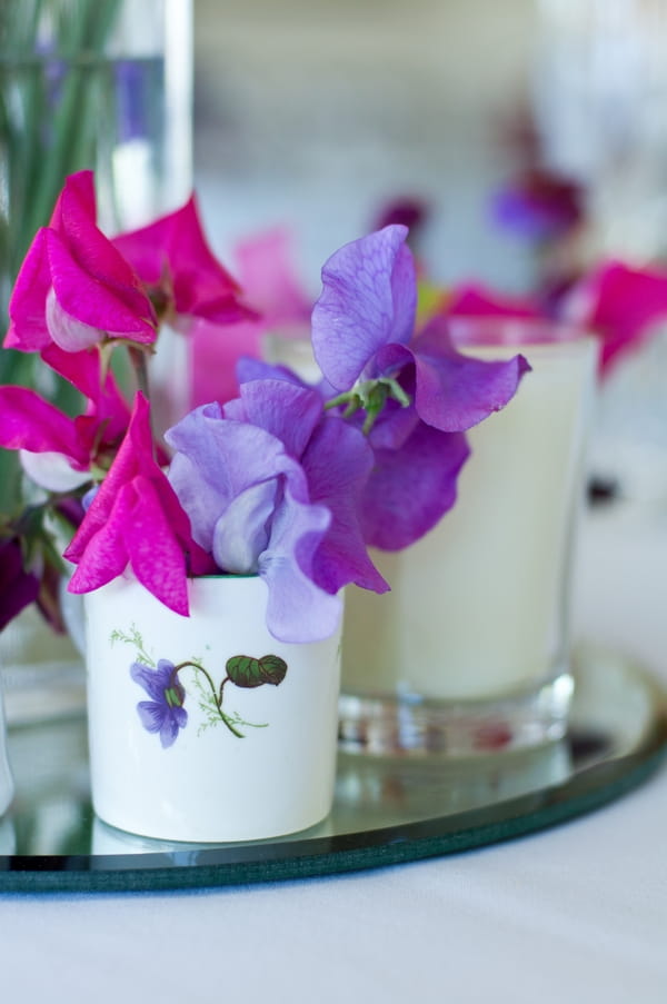 Purple flowers and candle