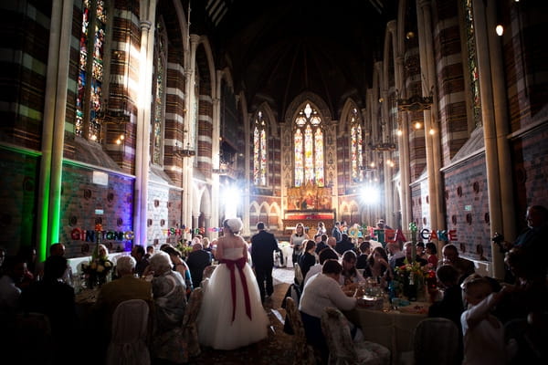 Bride and groom entering wedding reception in All Saints Chapel