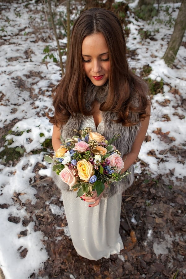 Bride holding pastel bridal bouquet