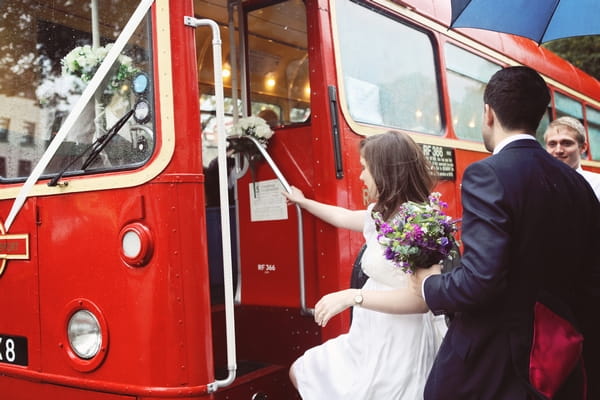 Bride getting on bus