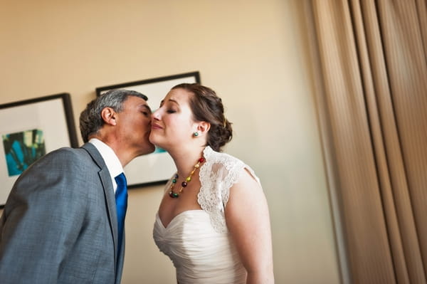 Bride kissing father