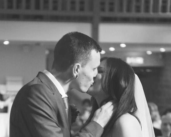 Bride and groom kiss