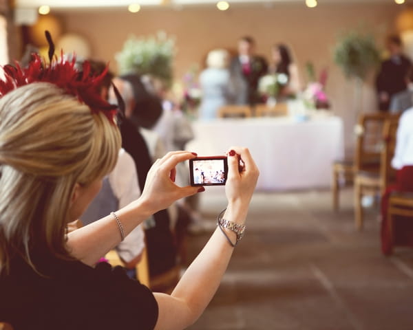 Wedding guest taking picture