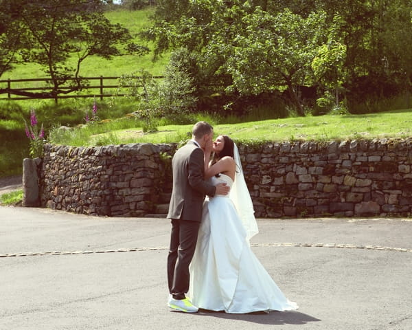 Bride and groom kiss