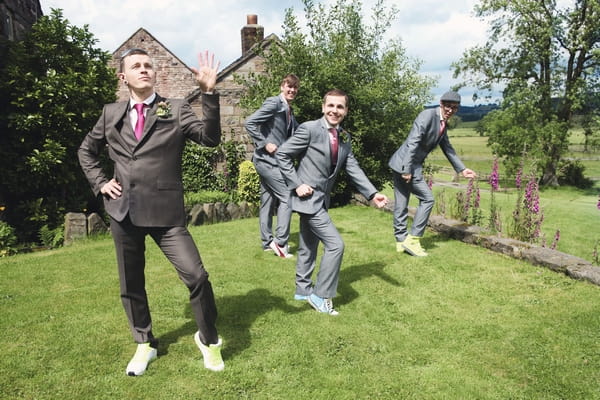 Groom and groomsmen dancing