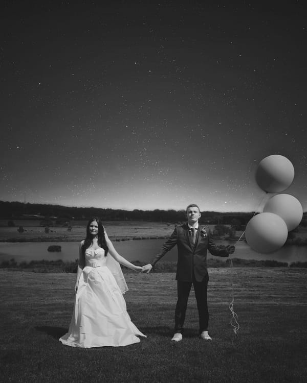 Bride and groom with balloons