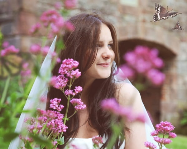 Bride in middle of purple flowers