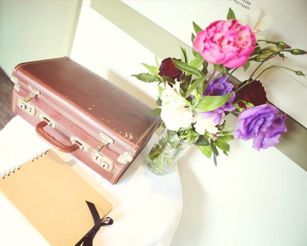 Suitcase and wedding flowers