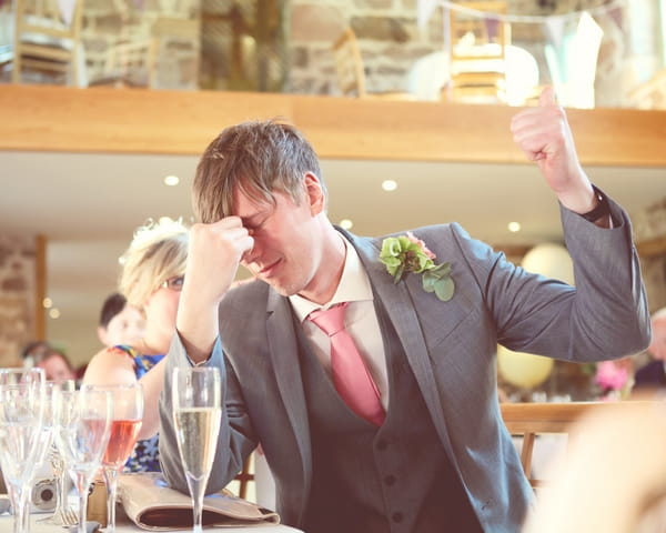 Best man giving thumbs up