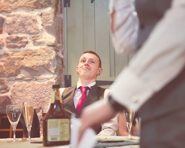 Groom listening to speech