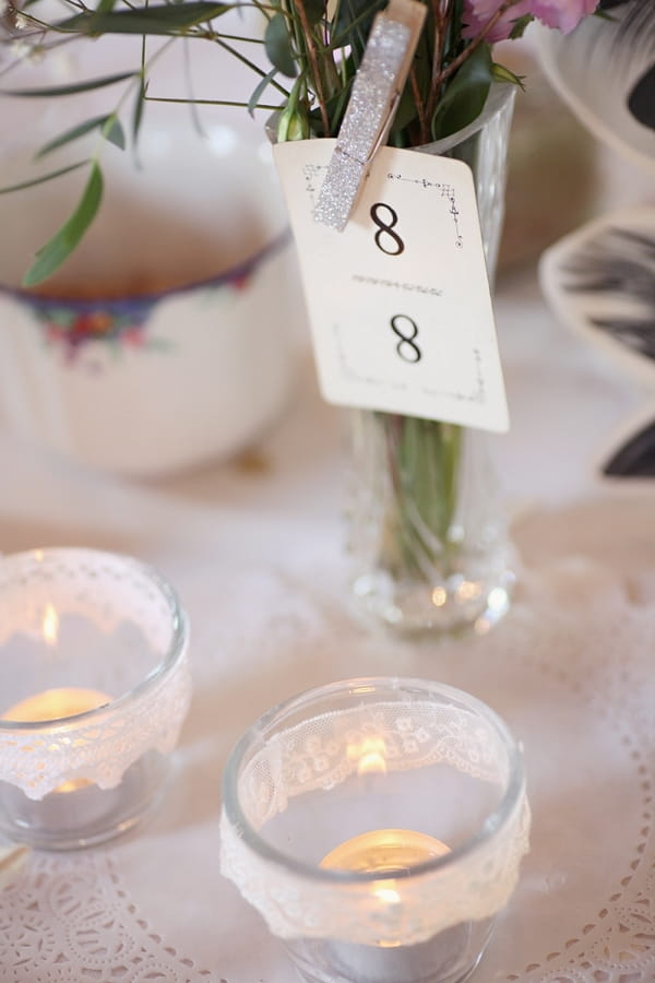 Candles and table number on wedding table