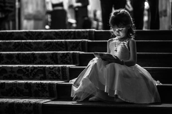Flower girl sitting on steps