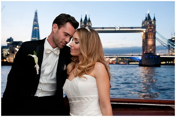 Bride and groom on boat on Thames