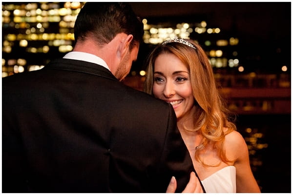 Bride seen from over groom's shoulder