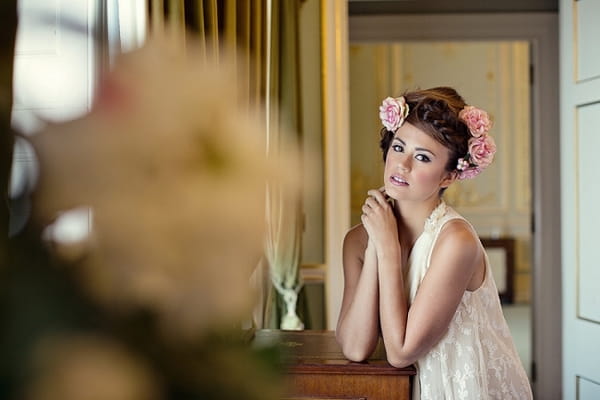 Bride with messy updo with flowers in hair