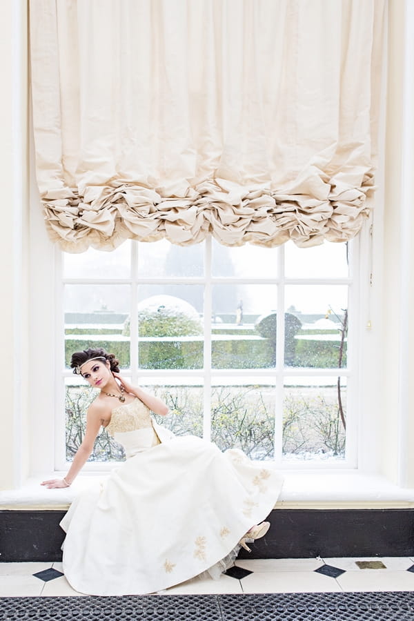 Bride laying across windowsill