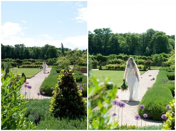 Bride walking through landscaped garden