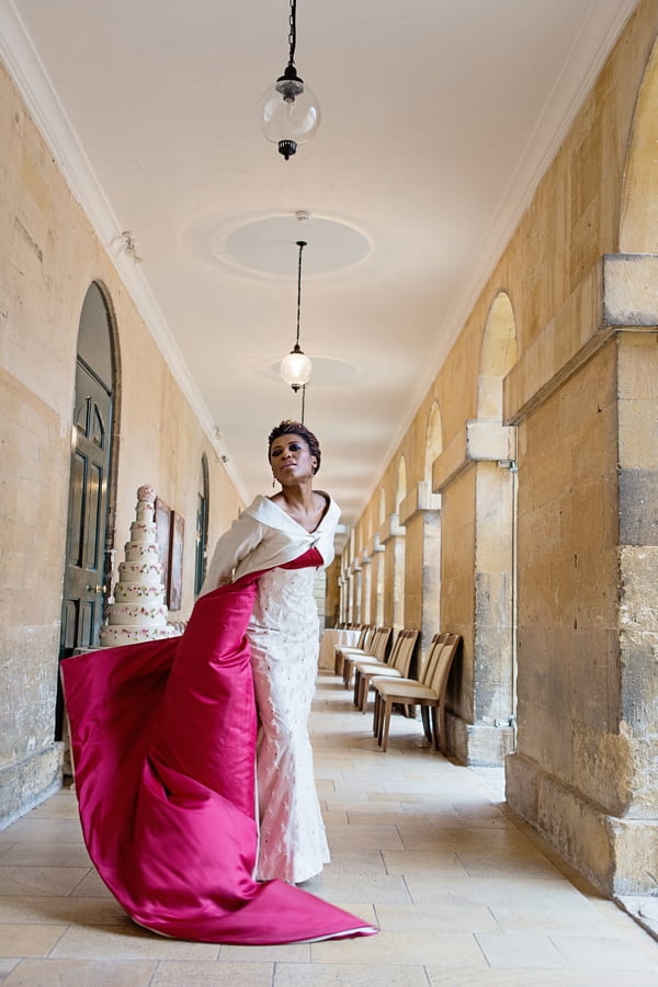 Bride with red-lined long wedding coat