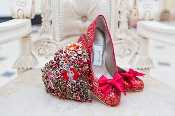 Red bridal shoes and heart brooch bouquet