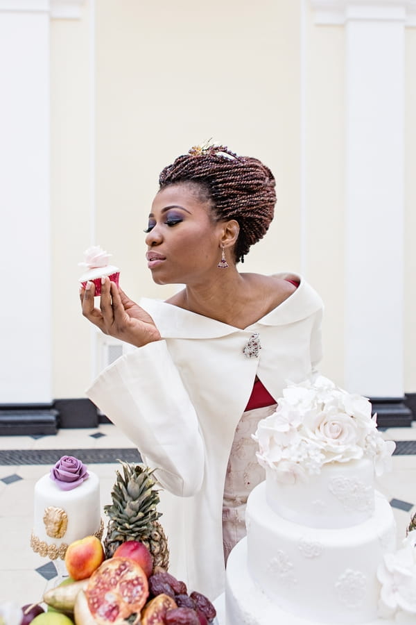 Bride holding cupcake