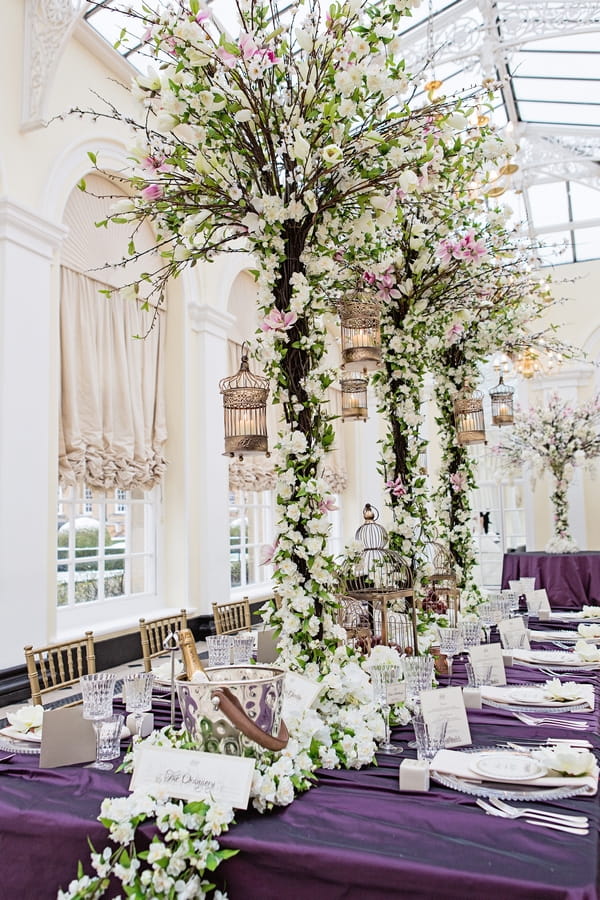 Long wedding table with trees