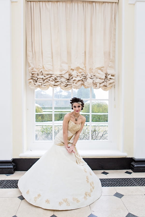 Bride in front of window