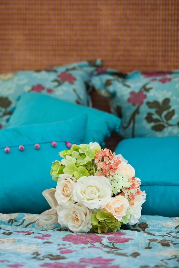 Bridal bouquet on bed