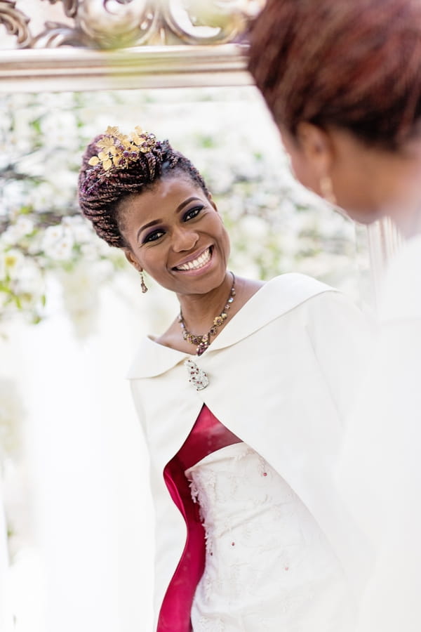 Bride smiling in mirror