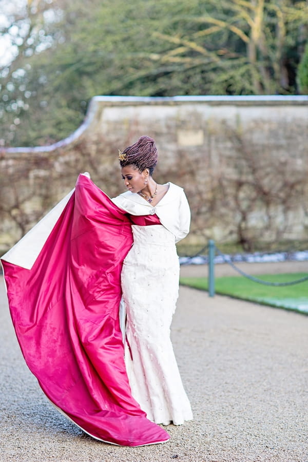 Bride with red-lined wedding coat