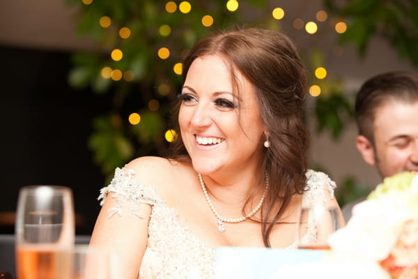 Bride smiling at speech