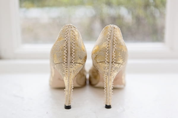 back of gold wedding shoes