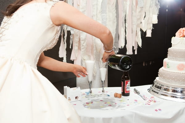 Bride puring Champagne