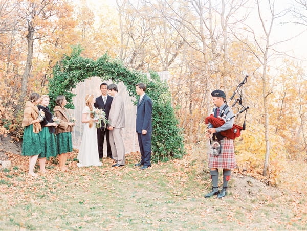 Wedding ceremony outside with bagpiper