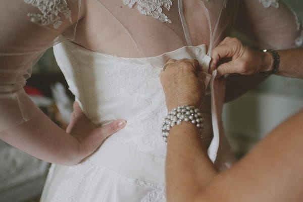 Wedding dress being done up