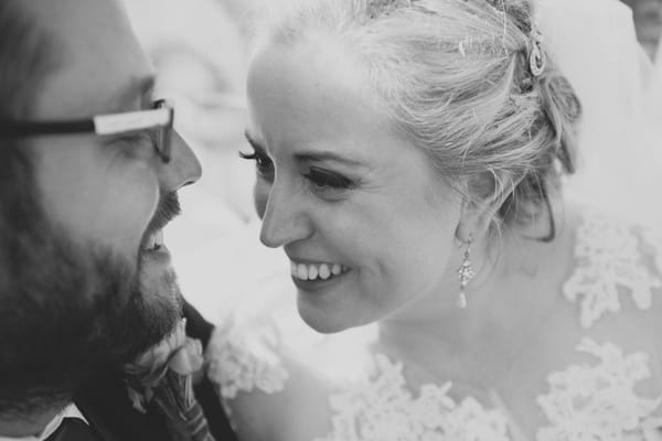 Bride and groom looking into each others eyes