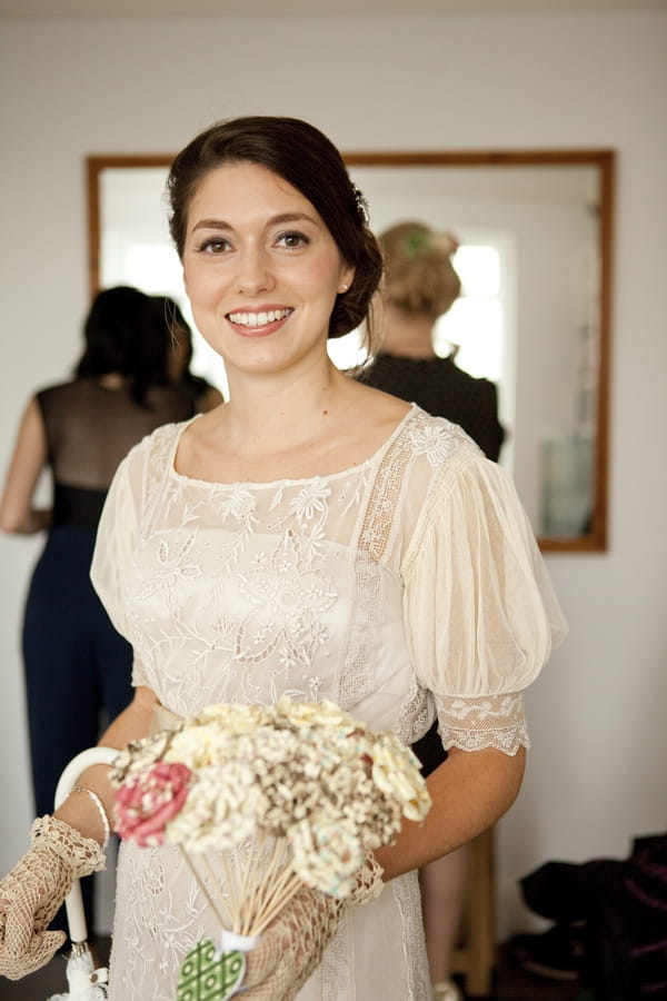 Vintage bride holding paper bouquet