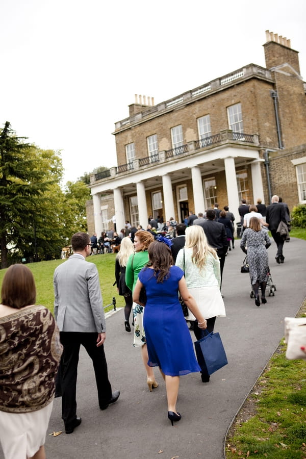 Wedding guests walking up to Clissold House