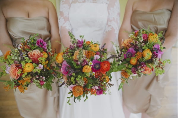 Bride and bridesmaids holding bouquets