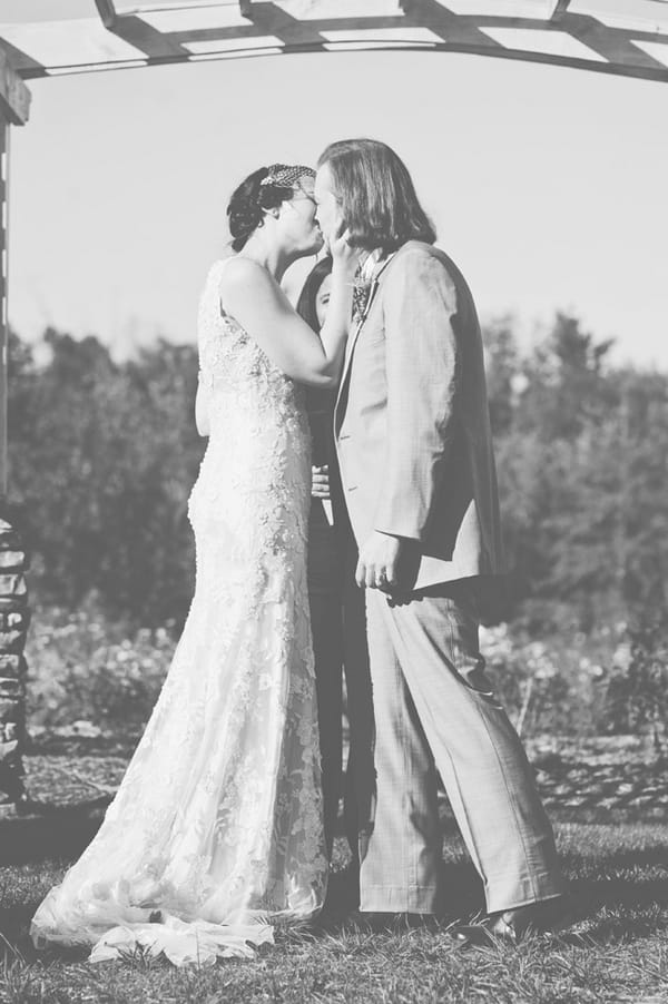 Bride and groom kiss