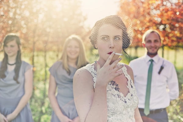 Bride smoking cigarette