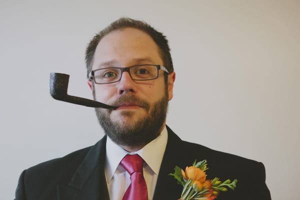 Groom with pipe