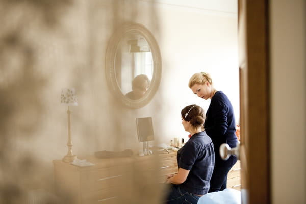 Bride having makeup done