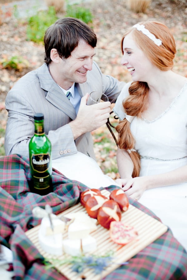 Bride and groom drink whisky