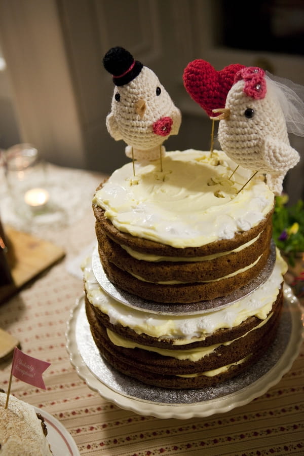 Wedding cake with knitted bird cake toppers