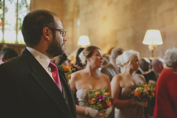 Groom looking to see bride