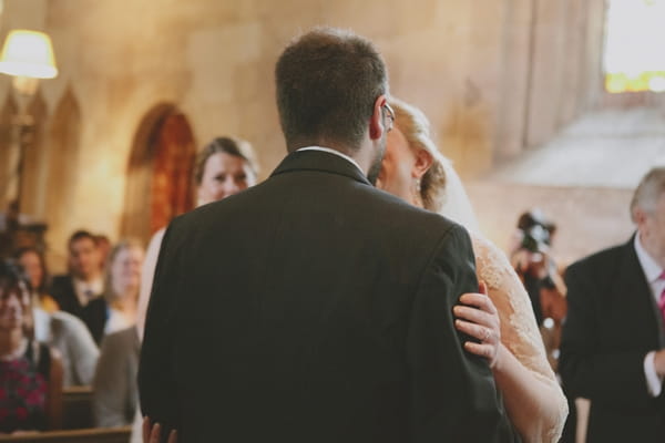 Bride and groom kiss