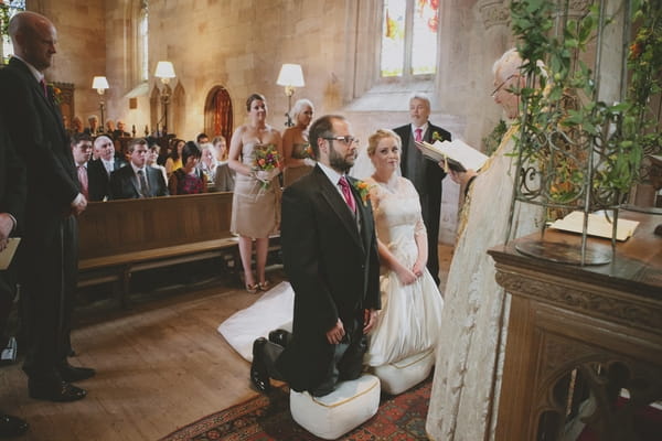 Bride and groom kneeling