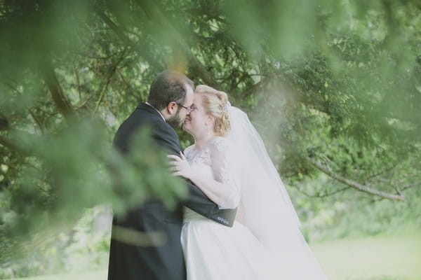 Bride and groom kissing